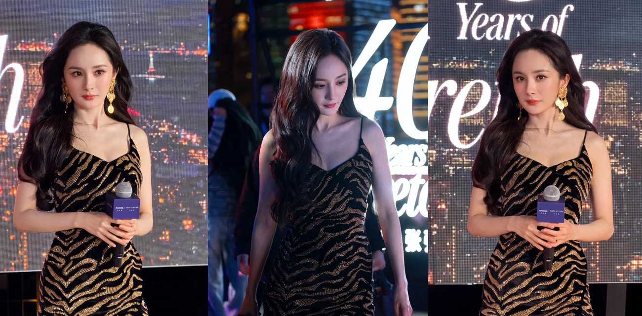 杨幂现身SW思缇韦曼40周年盛典 黑金吊带裙长短引争议 中途肩带滑落酥胸弹出！